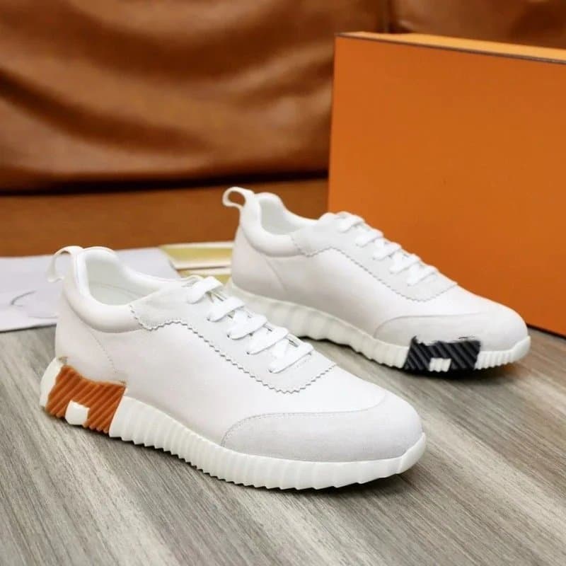 Hermès Oran Sneaker White with Orange and Black Accents