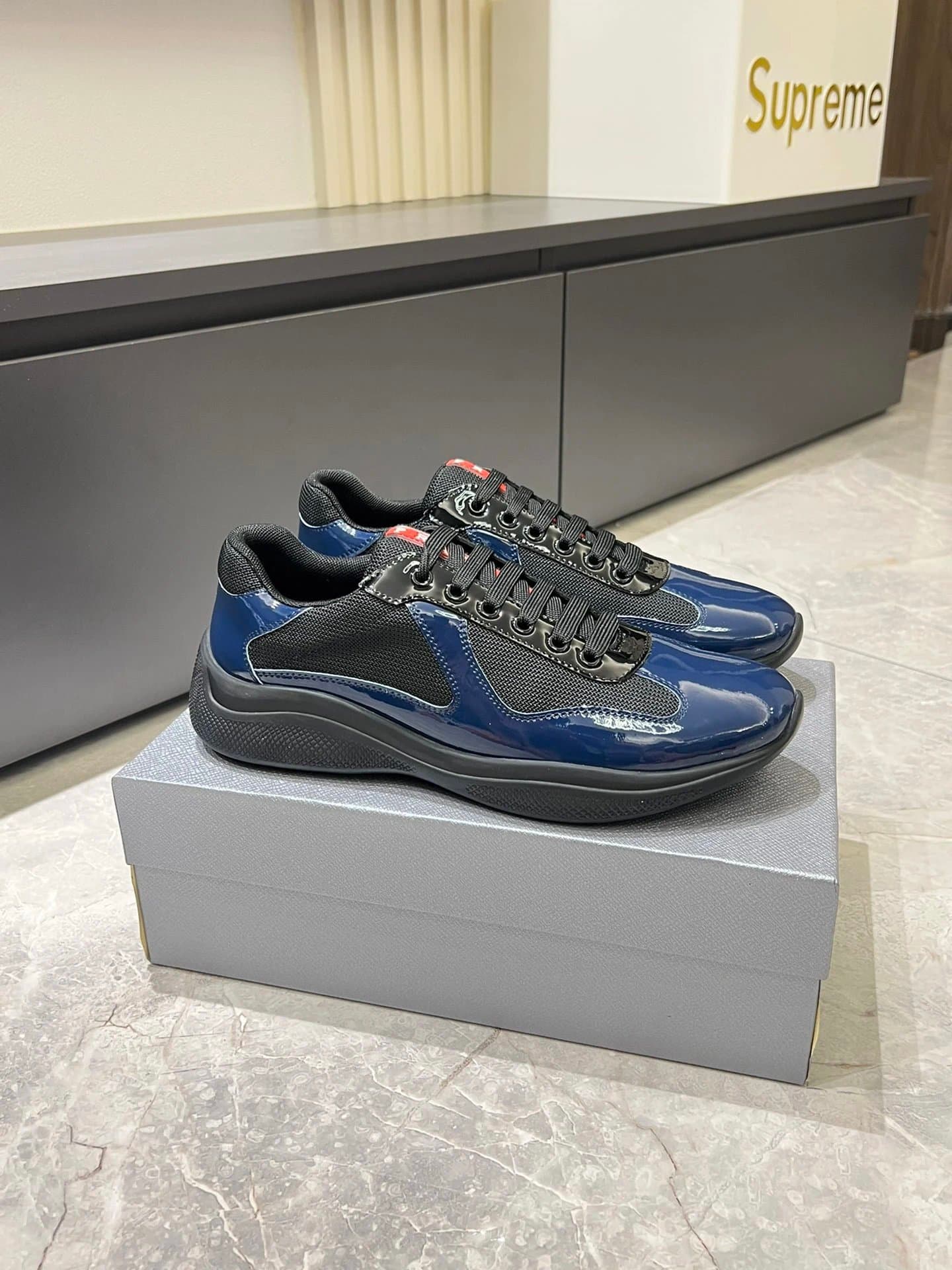 Prada × Supreme Clever Sneaker Navy Patent Leather