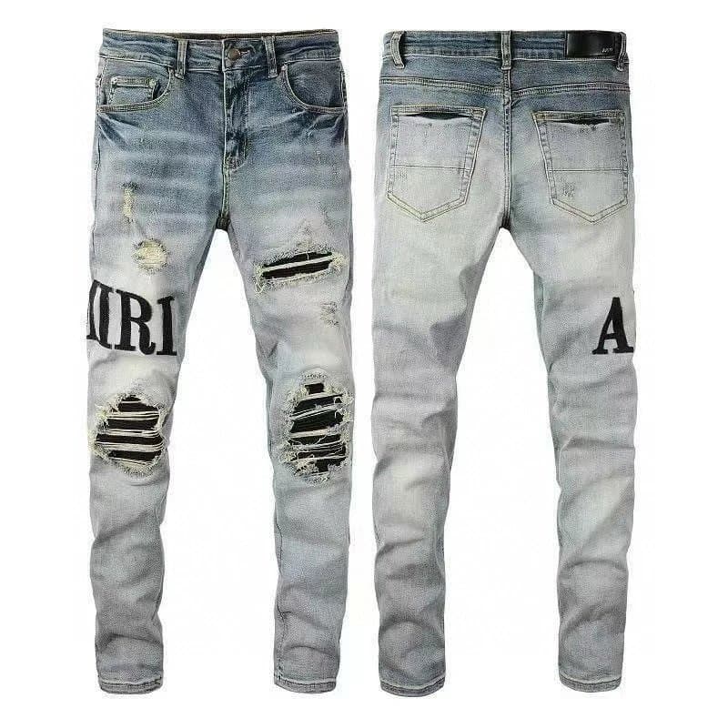 Amiri Distressed Jeans IRIAM Logo Patch — M56